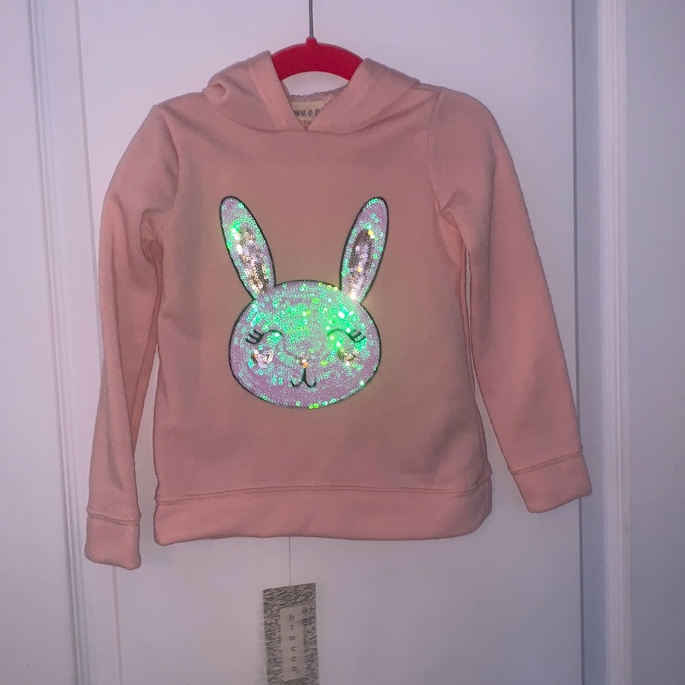 Pink hooded sweatshirt and pink leggings with gold hearts